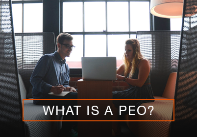 Man and woman working on a computer